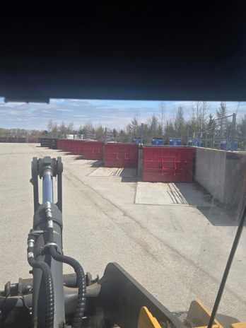 The image show 6 new red bins at the Elma landfill.